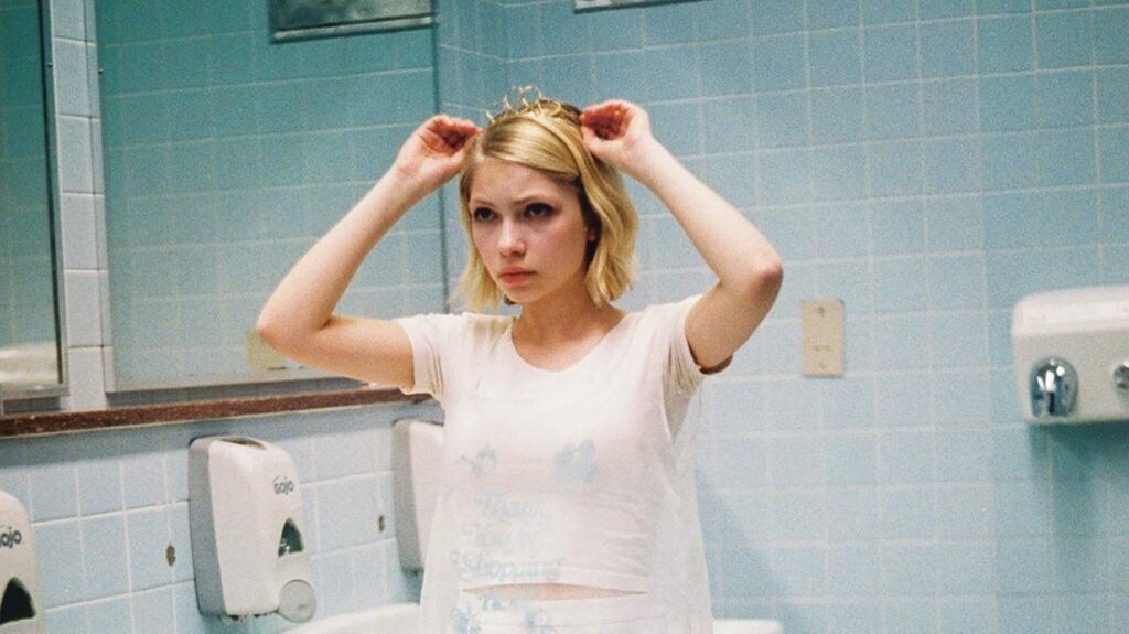 A woman combs her hair in a fashionable bathroom.