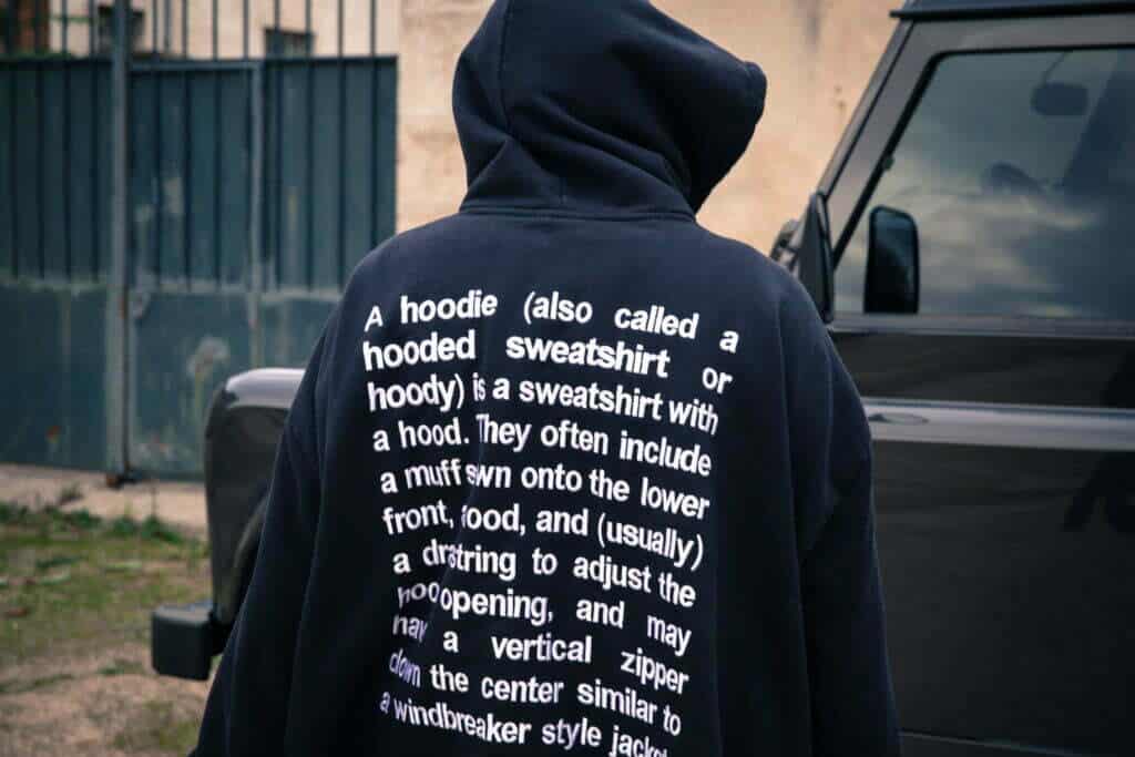 The back of a man wearing a hoodie.