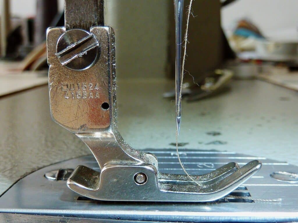 A sewing machine with a needle attached, designed to control the horror vacui of the corporate Instagram.