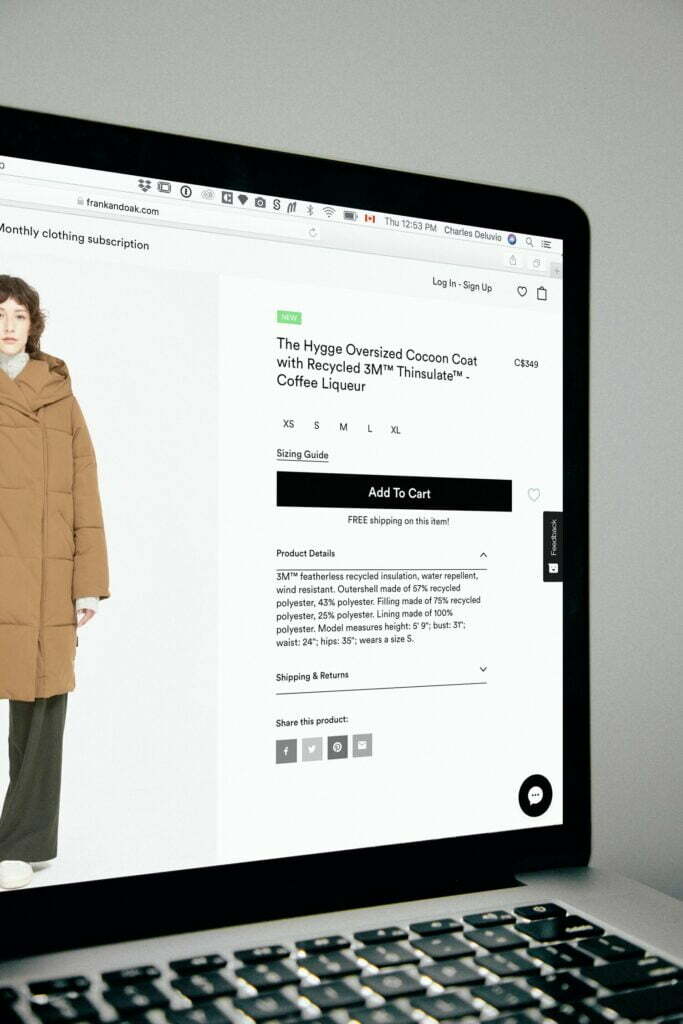 A woman's coat is displayed on a laptop screen during the coronavirus pandemic.