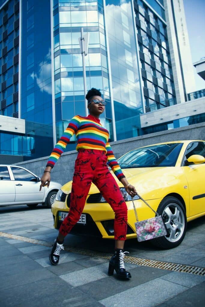 A woman in bright clothes strolling by a sunny vehicle, a beautiful hunting job that becomes more and more sought after.