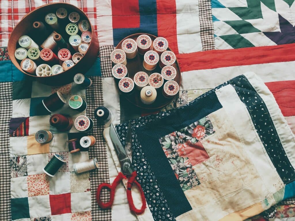 Patchwork supplies and a table set for DIY projects.