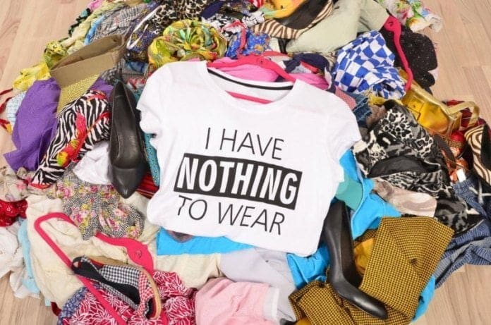 A pile of clothes with online fashion written on them.