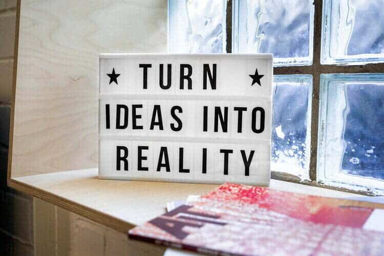 A light box with words turns ideas into reality on a window sill for fashion entrepreneurs.