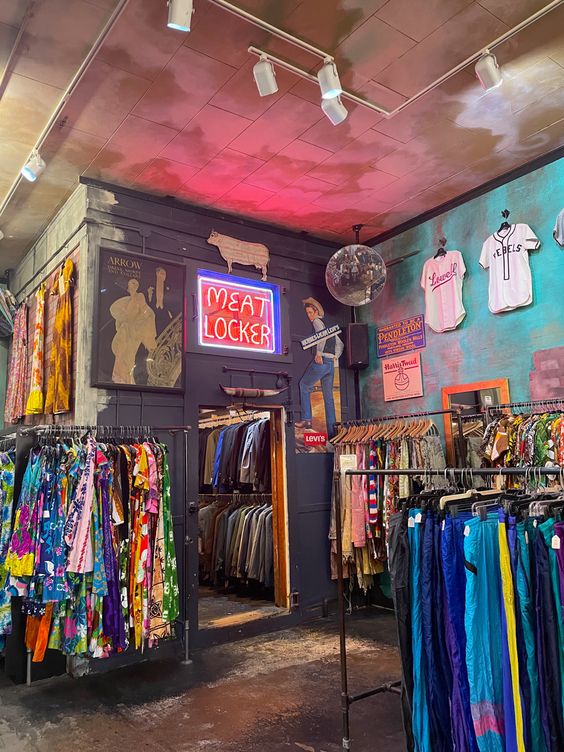 A fashionable shop with iconic fashion items hanging on shelves.