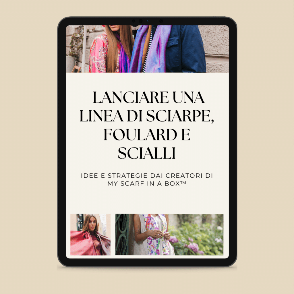 Une tablette montrant une page web en italien sur le lancement d'une ligne de foulards, avec des photos de femmes portant différents foulards.