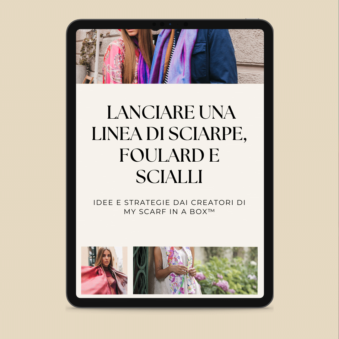 Une tablette montrant une page web en italien sur le lancement d'une ligne de foulards, avec des photos de femmes portant différents foulards.