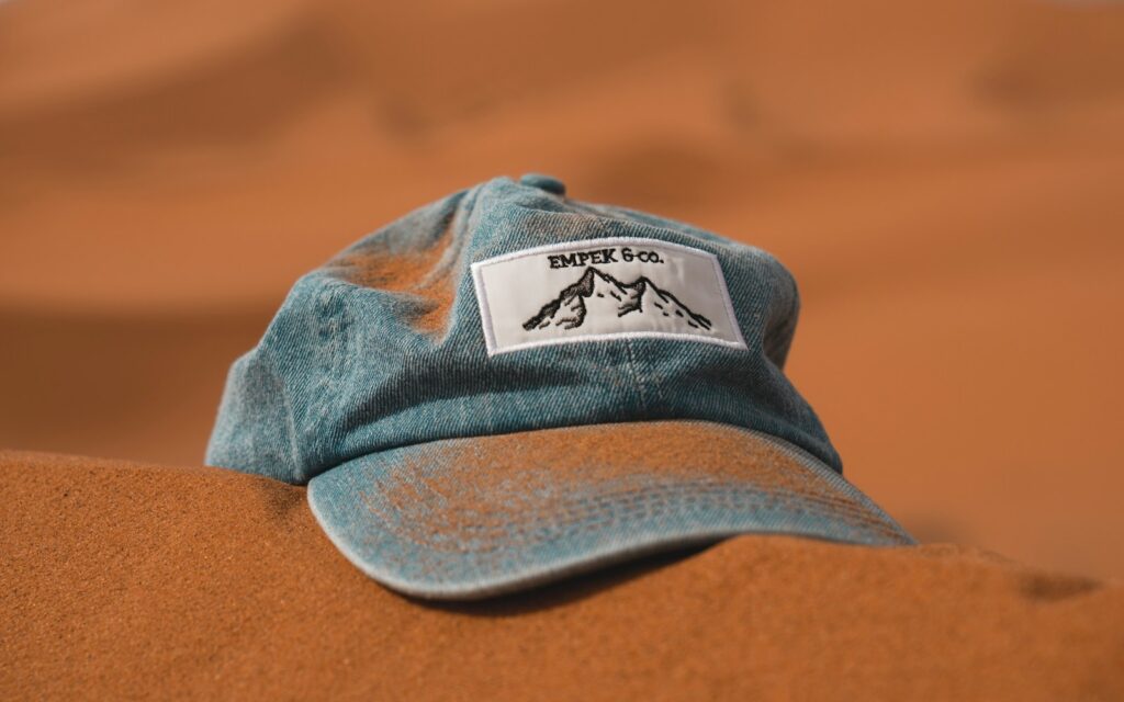 blue cap on brown sand